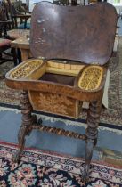 A Victorian walnut work table with a hinged top enclosing a fitted interior over twin barley twist
