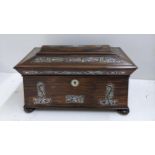 A William IV rosewood sarcophagus formed box, inset with mother of pearl and standing on bun