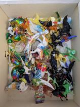 A collection of glass animals to include penguins, ducks, horses and other animals Location: If