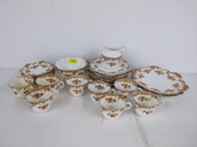 An early 20th century Paragon tea set comprising 2 dinner plates, 11 side plates, 6 saucers, 8 cups,