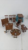 Mixed dolls house furniture signed WB to include a four post bed, four chairs, chest of drawers