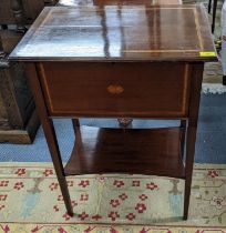An Edwardian mahogany and boxwood inlaid sewing table having a hinged top with shelf below, 78.5cm h