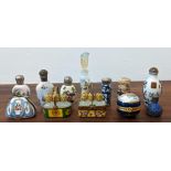 A collection of miniature scent bottles including one porcelain with a hallmarked cap, a Limoges
