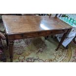 A late Victorian Warring & Gillows style side table having two short drawers and reeded tapering