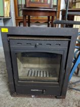 A cast metal wood burning stove Location: