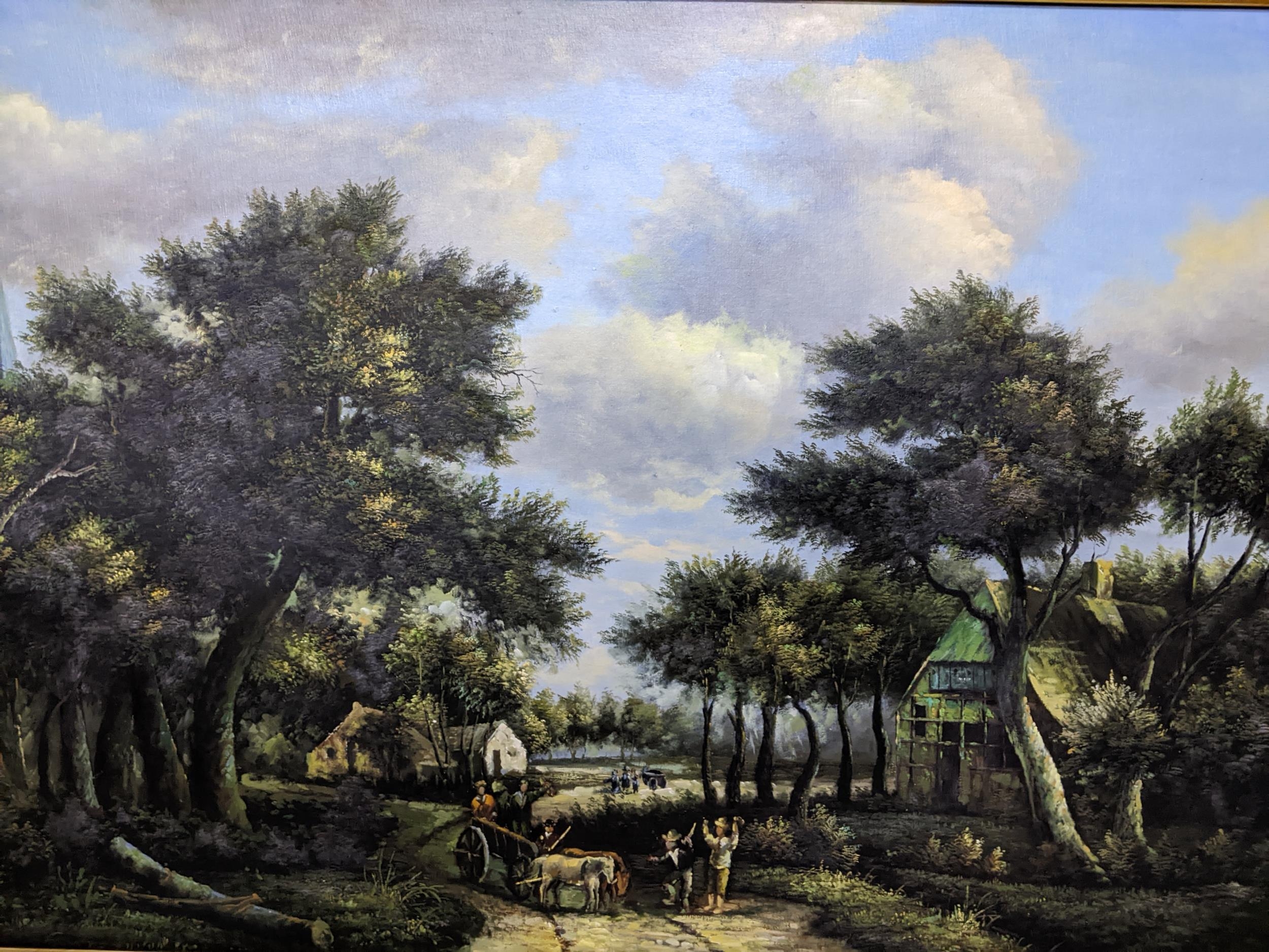 A late 20th century oil painting on board depicting figures in a horse drawn cart in an extensive