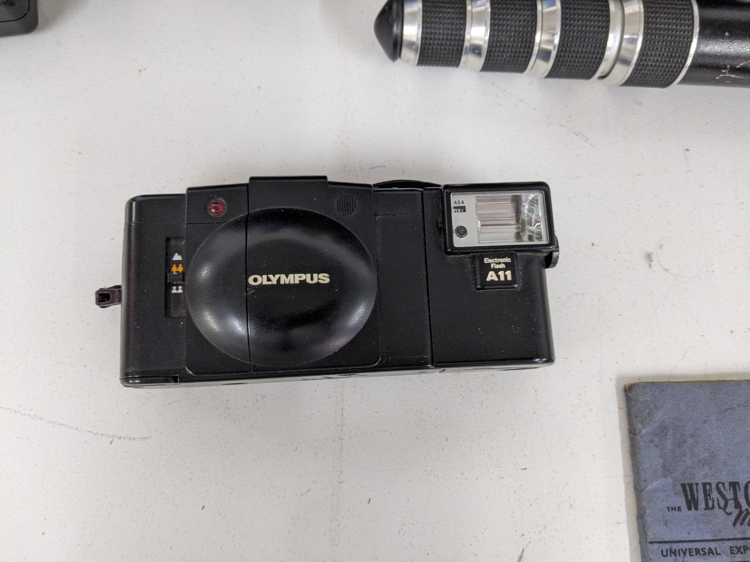 Olympus cameras, equipment and photography accessories to include two Olympus OM-2s, an Olympus OM- - Image 4 of 10