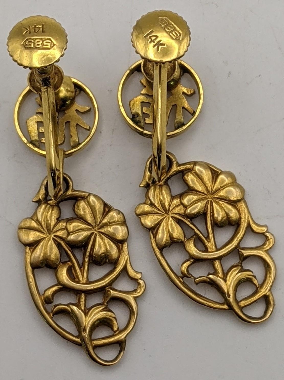 A pair of 14ct gold earrings having a floral pierced design Location:CAB5 - Image 2 of 2