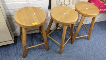 A set of eight beech circular topped stools 49.5h Location: