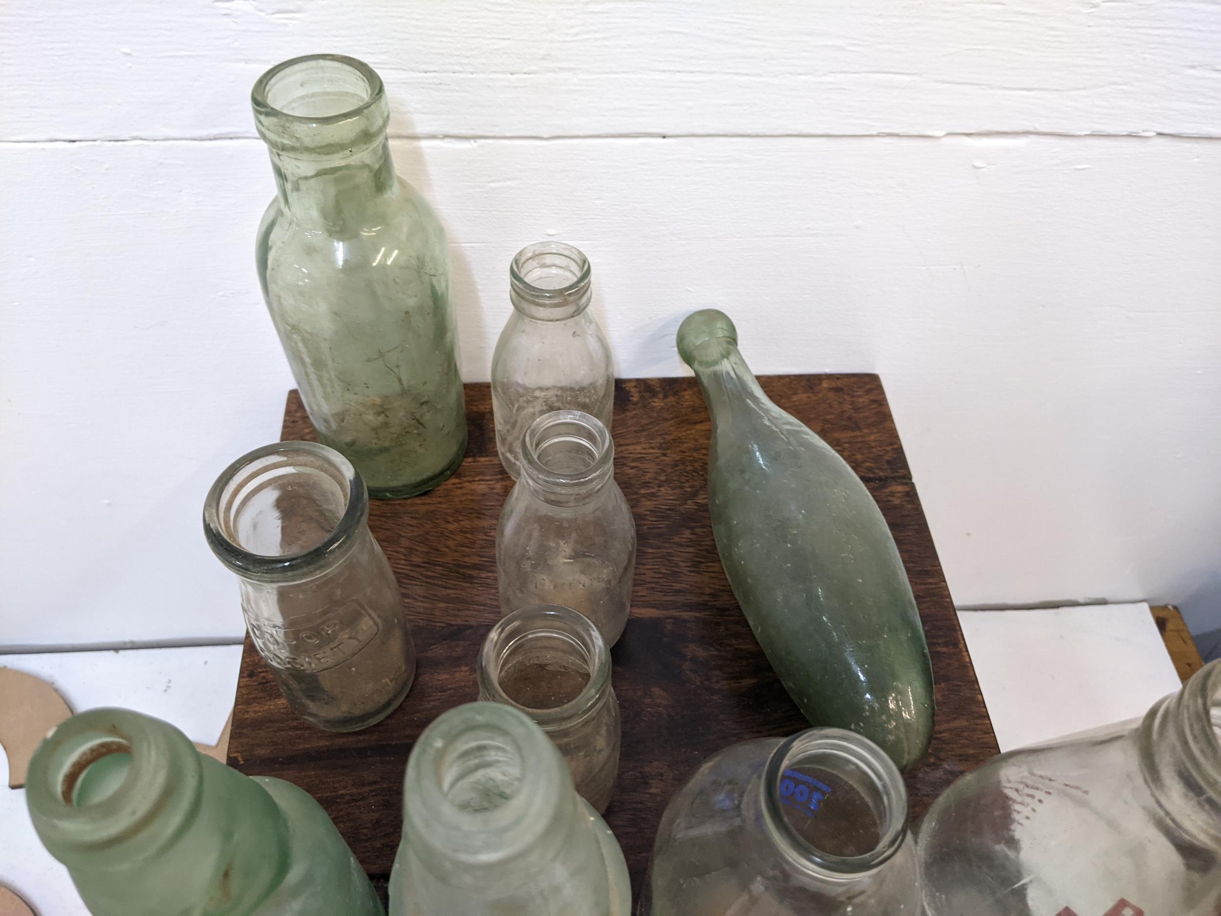 Vintage glass bottles, a hot water bottle, a small table and letters Location: If there is no - Image 6 of 7