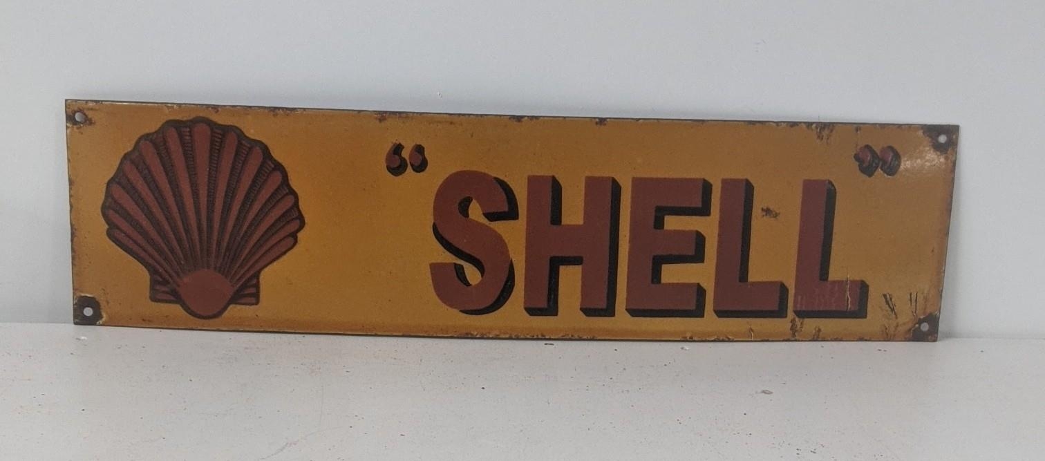 A late 20th century shell and enamel advertising sign 61cmW x 15.5cm H Location: If there is no