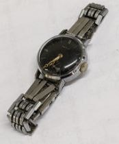 A Revue manual wrist watch with a black dial Location: If there is no condition report, please