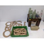 Vintage glass bottles, a hot water bottle, a small table and letters Location: If there is no