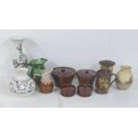 Mixed pottery items to include four glazed brown cooking pots, a blue and white vase with a floral