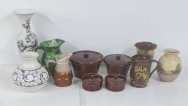 Mixed pottery items to include four glazed brown cooking pots, a blue and white vase with a floral