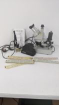 A Meiji EMT 54085 Laboratory microscope together with a minicine magic lantern and film and one
