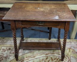 An early 20th century oak side table having a single drawer and barley twist legs, 74.5cmh x 76cmw