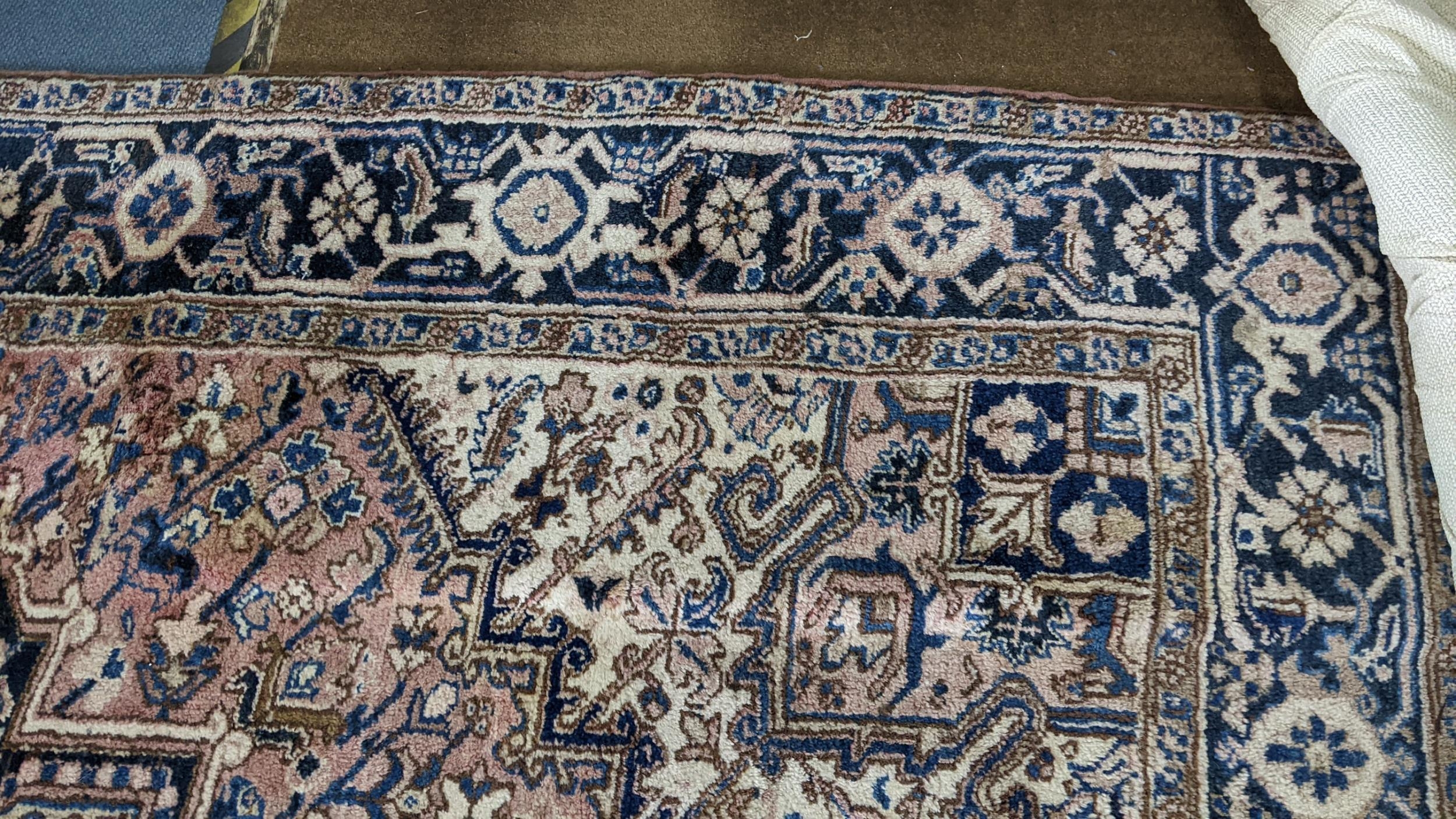 A Persian handwoven rug having a central motif and geometric designs 333cm x 250cm Location: If - Image 3 of 5