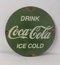 A late 20th century Coca cola enamel advertising sign 38cm diameter Location: If there is no