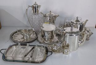 Silver plated items to include two teapots, a claret jug, a coffee pot, tray, miniature clock and