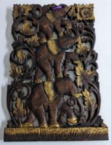An ornate carved treen wall panel carved in the shape of elephants, 30cm x 45.5cm Location: If there