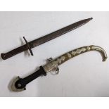 An Italian early 20th century bayonet, engraved C Gnutti, a Middle Eastern curved dagger with silver