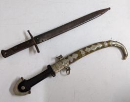 An Italian early 20th century bayonet, engraved C Gnutti, a Middle Eastern curved dagger with silver