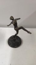 A bronze coloured sculpture of a dancing lady, on a marble base, 165cm h Location: If there is no