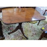 An early 20th century Regency style mahogany occasional table having a turned column and three