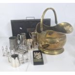 Mixed metal wear to include a Victorian brass coal scuttle, silver plated tankards, two toast racks,