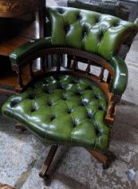 A reproduction green leather button back upholstered swivel Captain's armchair Location: If there is