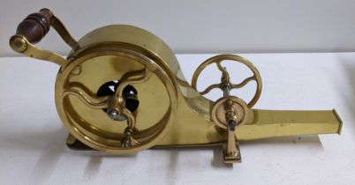 A 19th century brass mechanical fire bellows with turned timber handles Location: