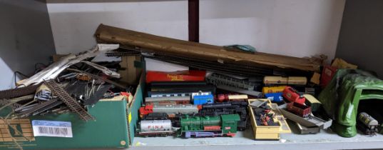 A Hornby train set to include engines, rolling stock and carriages, track and various accessories,