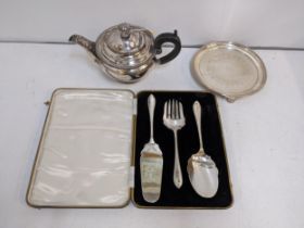A boxed silver plated desert set to include a silver plated teapot on a plated stand with ornate