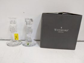 A pair of Waterford crystal candlesticks with Prentiss pattern on a dodecagonal base 15cmh (boxed)