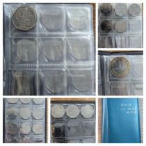 An album of 20, 50p and one £2 coin to include a replica/re-strike 2009 Kew gardens 50p, London