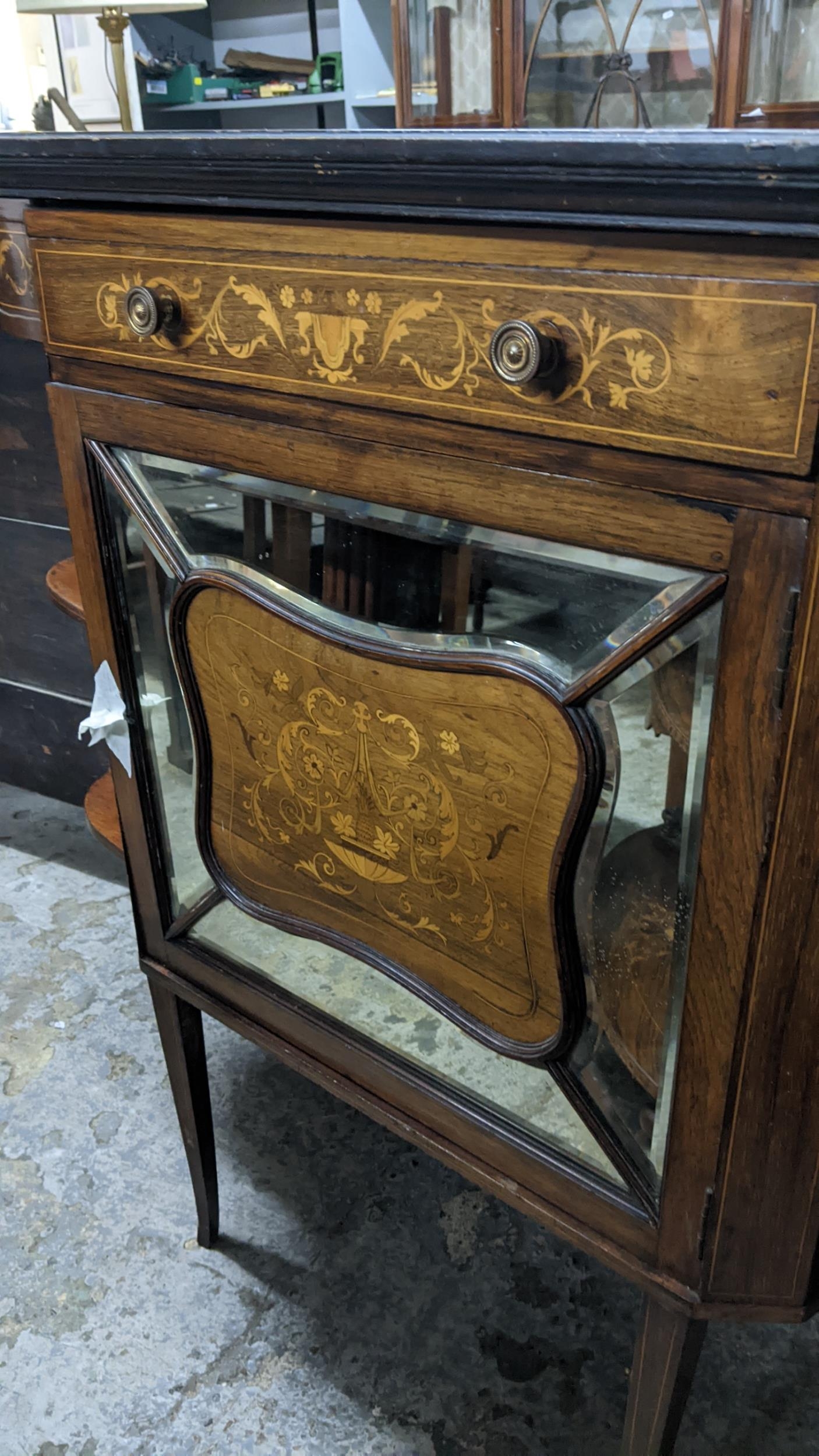 A late Victorian walnut cabinet having marquetry inlaid open shelves, single drawer and a mirrored - Image 3 of 3