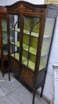 An Edwardian mahogany two door glazed display cabinet on four tapering legs, 172.5cm h x 90.5cm w