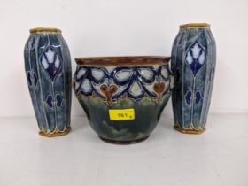 A Royal Doulton jardinière, 15cm h x 17cm dia, together with a pair of Royal Doulton vases decorated