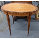 A late 19th/early 20th century satinwood oval topped occasional table having parquetry inlaid and on