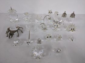 A mixed lot of miniature crystal figurines, some marked Swarovski to include a beetle, owl, salt and