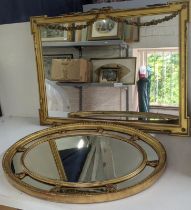 Two gilt mirrors to include a rectangular shaped mirror with ribbon tied floral sway decoration A/F,