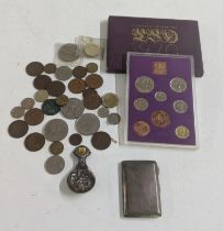 A mixed lot to include an engine turned cigarette case, 64.8g, mixed British coinage and a tea caddy