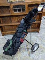 A set of ladies Pro Kennex golf clubs and golf bag, full set hardly used, including a trolley,