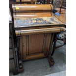 A Victorian inlaid ebony and walnut Davenport, with an arched top, over a hinged flap with a