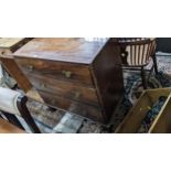 A Georgian mahogany chest of small proportions, three long drawers with brass swan neck handles,