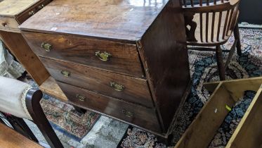 A Georgian mahogany chest of small proportions, three long drawers with brass swan neck handles,
