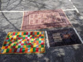 Two Pakistan Bokhara rugs largest 188cms & 121cms and a geometric woollen rug Location: If there