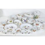A collection of Royal Worcester Evesham pattern to include tureens, a biscuit jar, ramekins,