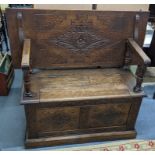 An early 20th century oak monks bench having carved diamond design motifs 97hx106.5w Location: